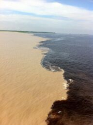“Meeting of the Waters” is the point at which the Rio Negro meets the Rio Solimões in the Brazilian state of Amazonas